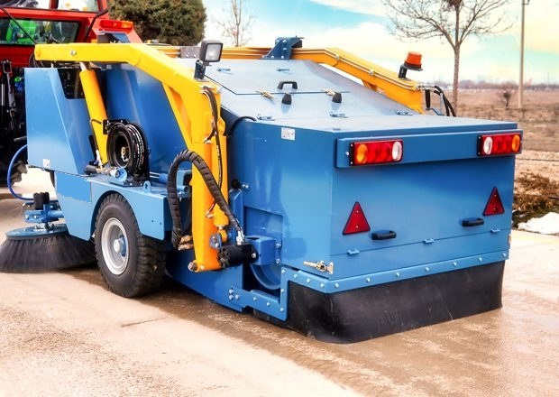 road sweeping equipment working in an outdoor operational area
